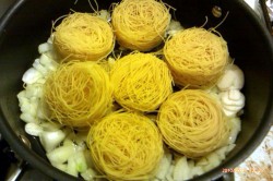 saute-ing onions, garlic and pasta nests